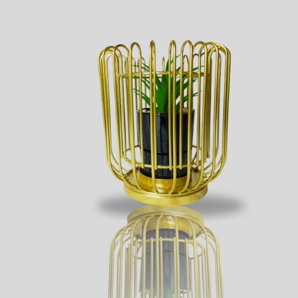 A gold-colored Nordic metal flower pot vase with a small plant inside, best for office and home decor